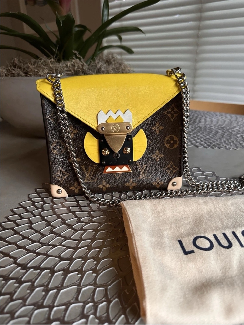 Louis Vuitton Limited Edition
Yellow Monogram Canvas Tribal
Mask Chain PM Bag